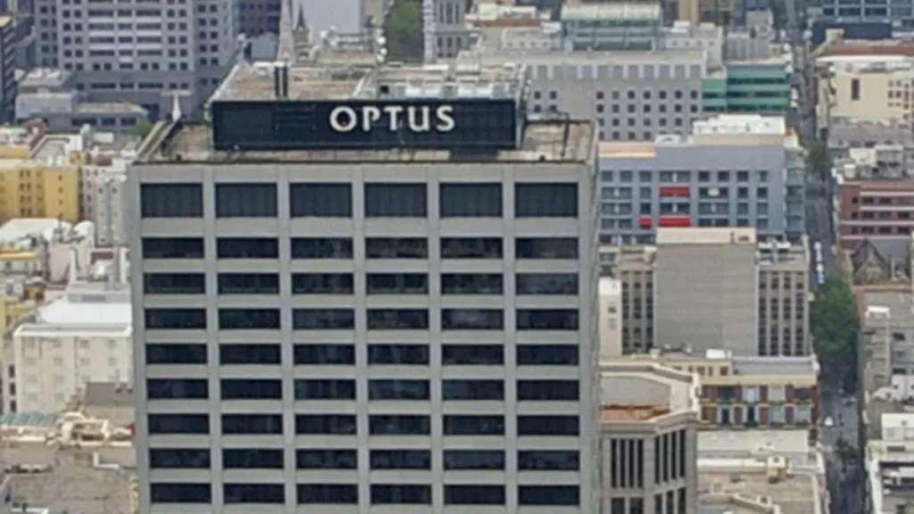 Illustrative: an Optus transmission tower in Melbourne. The article reports a 75-minute Optus voice outage on 11 September 2026 in which more than 40 callers had trouble reaching triple zero.